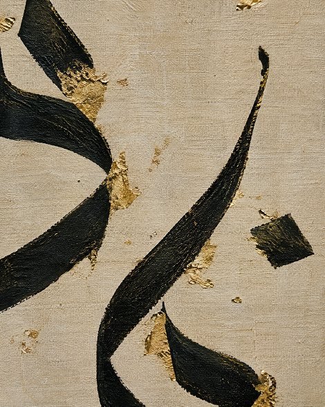 Close-up of hand-painted black and gold canvas